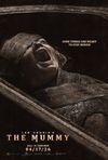 Lee Cronin's The Mummy poster. A half-mummified child screams from within an ancient sarcophagus. The subtitle reads, 'Some things are meant to stay buried'.